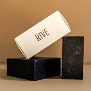 RIVE soap bar displayed with black and white packaging for skincare.