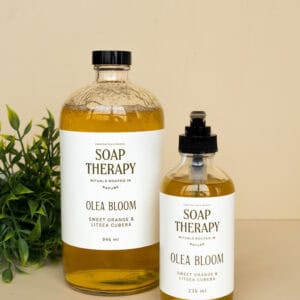 Olea Bloom soap therapy bottles with orange and litsea cubeba scent.